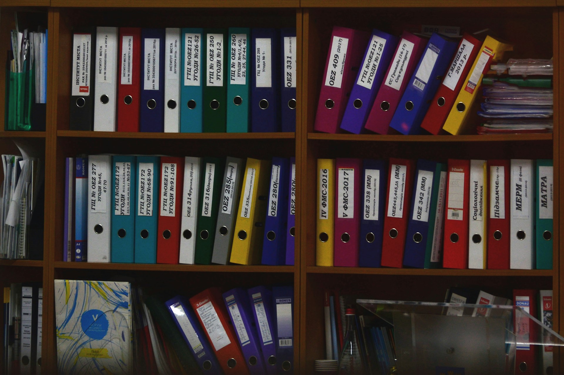 Bookshelves filled with binders collected in an Archive.