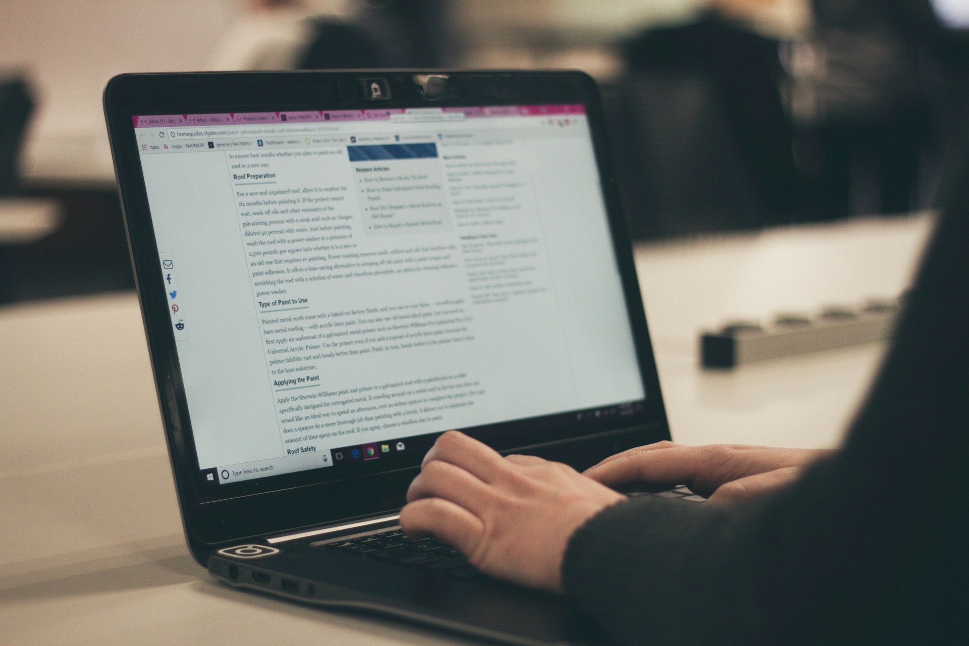 A person writing in their blog in their computer.