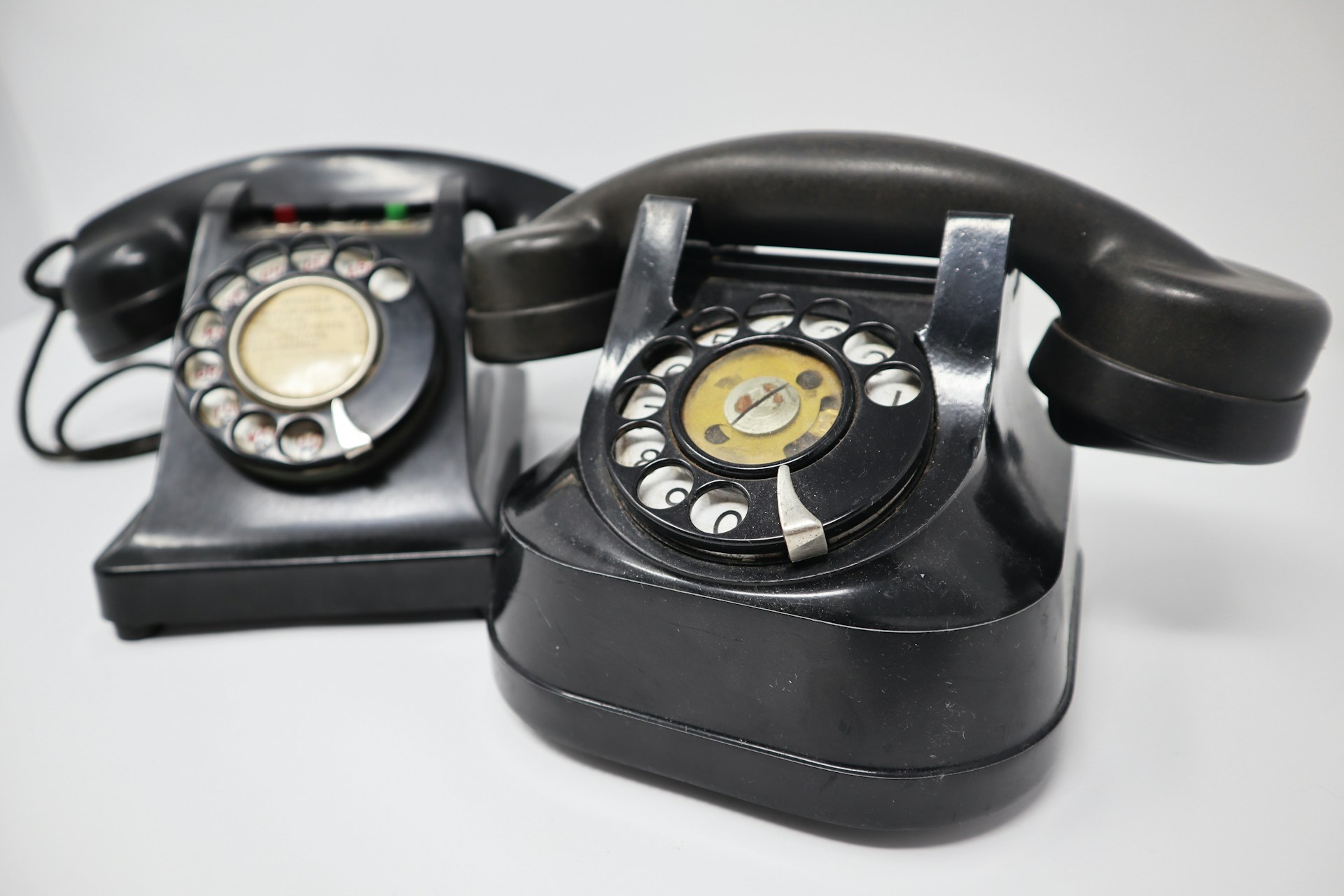 Two rotary telephones.
